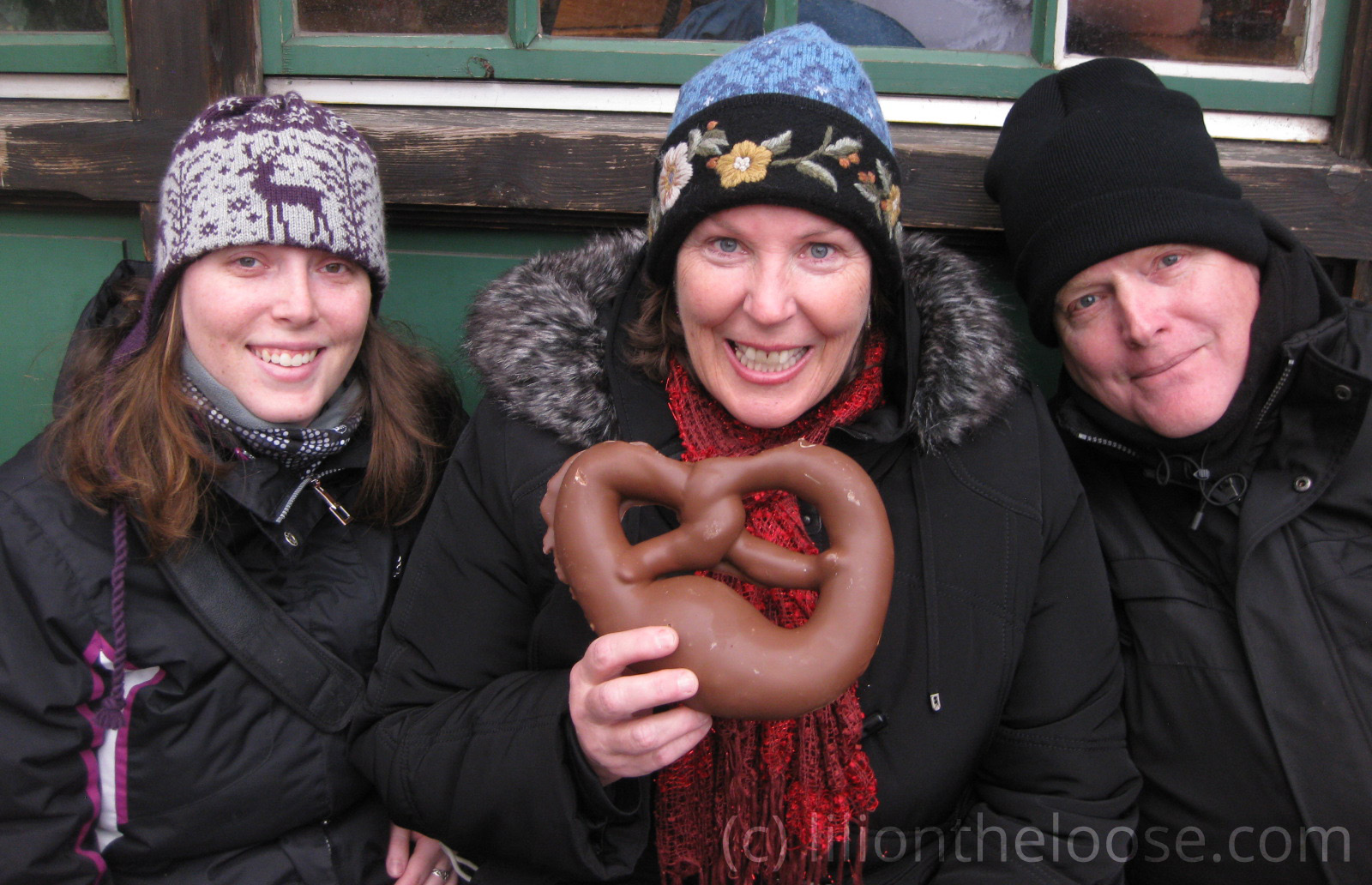 Myself, my mother, and father about to enjoy a huge milk-chocolate pretzel.